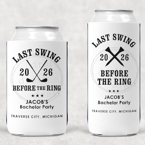 May include: White can coolers with black text that reads "LAST SWING BEFORE THE RING" with crossed golf clubs and the year 2026. Includes "JACOB'S Bachelor Party" and "TRAVERSE CITY, MICHIGAN".