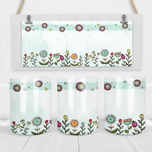 May include: Three white ceramic mugs with a light blue background and a border of colorful flowers. The mugs have a white handle and are blank for personalization.