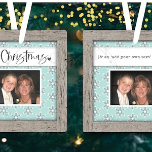 May include: Two Christmas ornament designs featuring a rustic wood frame with a light blue background and a snowflake pattern. One design says "Merry Christmas" and the other says "[& an 'add your own text' version]". Both designs include a photo of a boy and a woman.