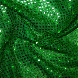 May include: Green fabric with a shiny, textured surface. The fabric is covered in small, round sequins.
