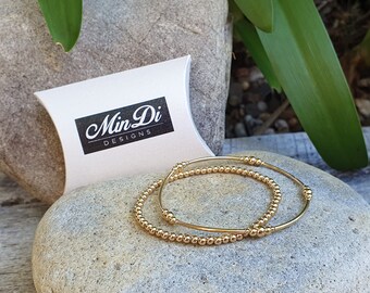 Set Of Two 14K Yellow Gold Filled Stretch Bracelets.