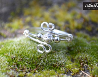 Handmade solid sterling silver adjustable wire ring.