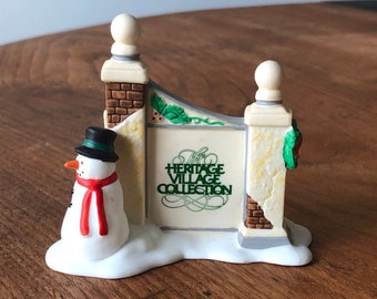 Dept 56-Heritage Village Sign with Snowman-with original box-Heritage Village Collection Series-Department 56-Sign in the Snow-Fancy Sign