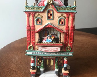 Dept 56-Maries Doll Museum-North Pole Series-1999-Retired 1999-Department 56-Lighted House-Grand Opening-Fine Porcelain Doll Collection