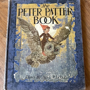 May include: Vintage hardcover book titled "The Peter Patter Book" with a blue and gold cover. The cover features an illustration of a child riding an owl. The book's title is in large, bold letters, and the author's name is also visible.