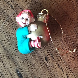 Load of Cheer-Little Elf on a Bomb-Hallmark-Keepsake Ornament-1989-Miniature Ornament-Christmas Ornament-Elf with Cherry Bomb-Striped Socks