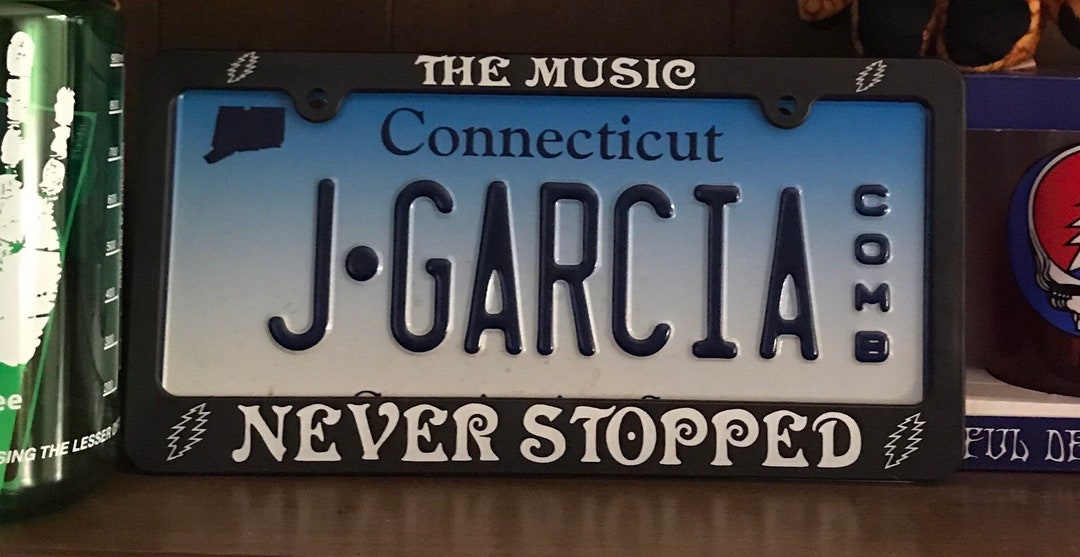 Grateful Dead License Plate Frame the Music Never Stopped / Jerry