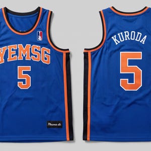 May include: A blue basketball jersey featuring orange and white trim, with the text YEMSG and the number 5 on the front, and the name KURODA and the number 5 on the back. The jersey includes black side panels and a small logo on the upper chest.