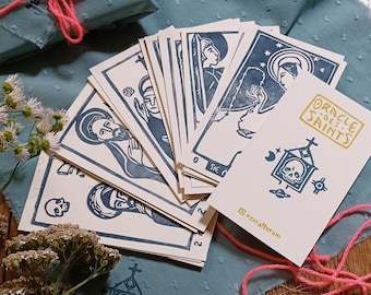 Oracle des Saints – Juego de 32 cartas linograbadas e impresas en la principal sur les saints catholiques