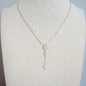 EVANGELINE - glamorous chic wedding necklace with its pearls and rhinestones, in a Y shape to dress up the neckline.