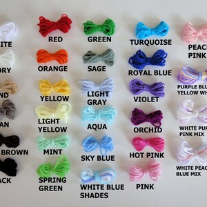 May include: A chart of yarn colors with the names of each color written below the yarn. The colors include white, ivory, sand, tan, dark brown, black, red, orange, yellow, light yellow, mint, spring green, green, sage, aqua, sky blue, turquoise, royal blue, violet, orchid, hot pink, peach pink, purple blue yellow white mix, white purple pink mix, and white peach blue mix.