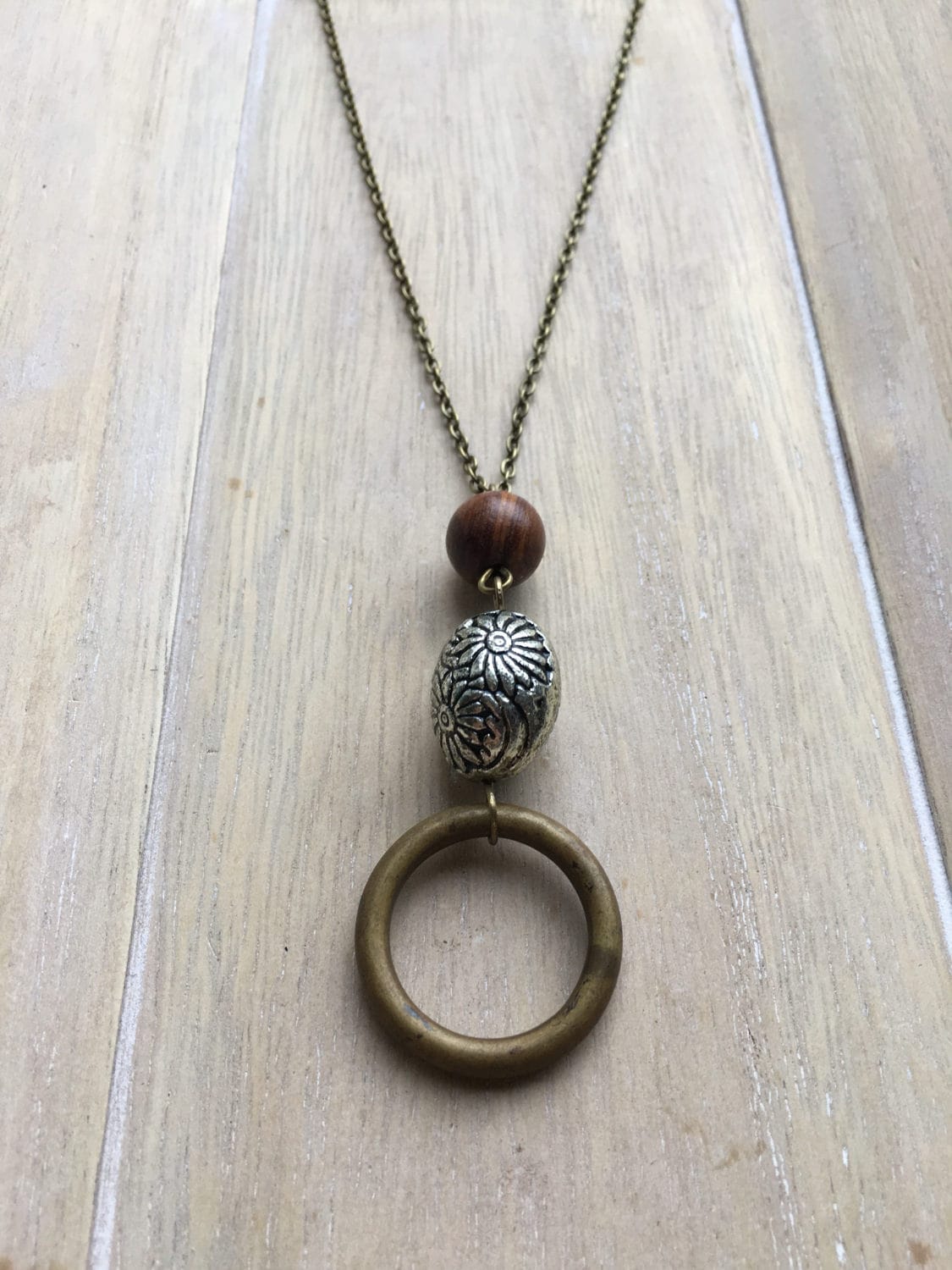 Long brown bronze colored necklace with beaded pendant. Etsy