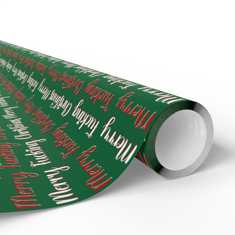 May include: Roll of green wrapping paper with a repeating pattern of "Merry" and "Happy Holidays" in white and red lettering.