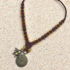 Macrame necklace with a steampunk metallic pendant - bee and old watch