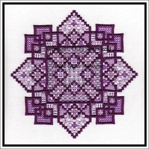 May include: A purple and white embroidered design with a geometric pattern. The design is surrounded by a border of purple embroidery. The text "Copyright Vicki Mansfield @ India Grace Designs" is visible in the center of the design.