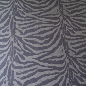 Denim look animal print stretch spandex knit fabric. 1/2 yd.