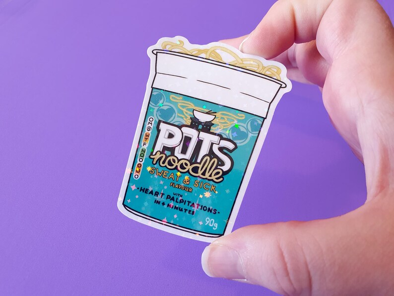 May include: A white sticker with a blue and green design of a cup of instant noodles. The sticker has the text "POTS noodle SWEAT & SICK" and "HEART PALPITATIONS - IN 4 MINUTES - 90g".