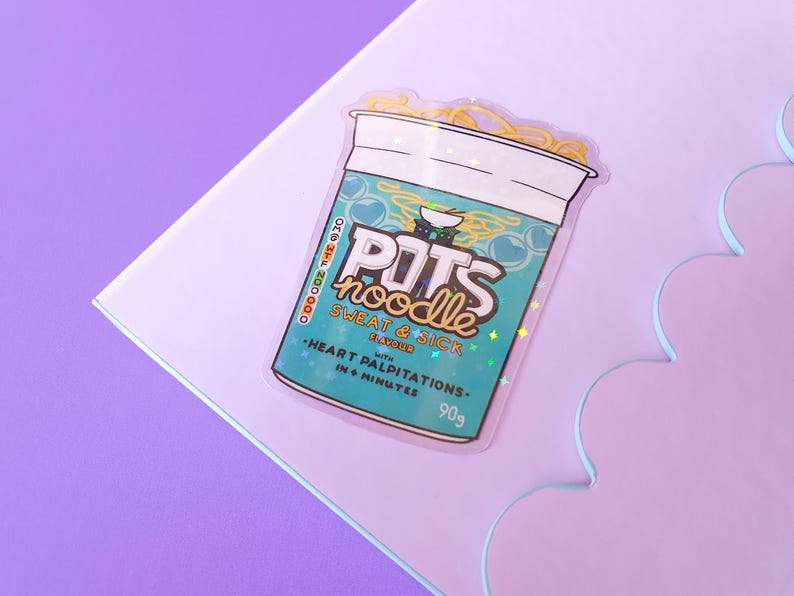 May include: A holographic sticker of a blue and green instant noodle cup with the text "POTS noodle" and "SWEAT & SICK FLAVOUR" with the text "HEART PALPITATIONS IN 4 MINUTES" and "90g".