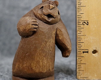 This artist carved wood bear is collectible, made in America; a miniature gift with original design, carved by hand, it makes a happy gift.