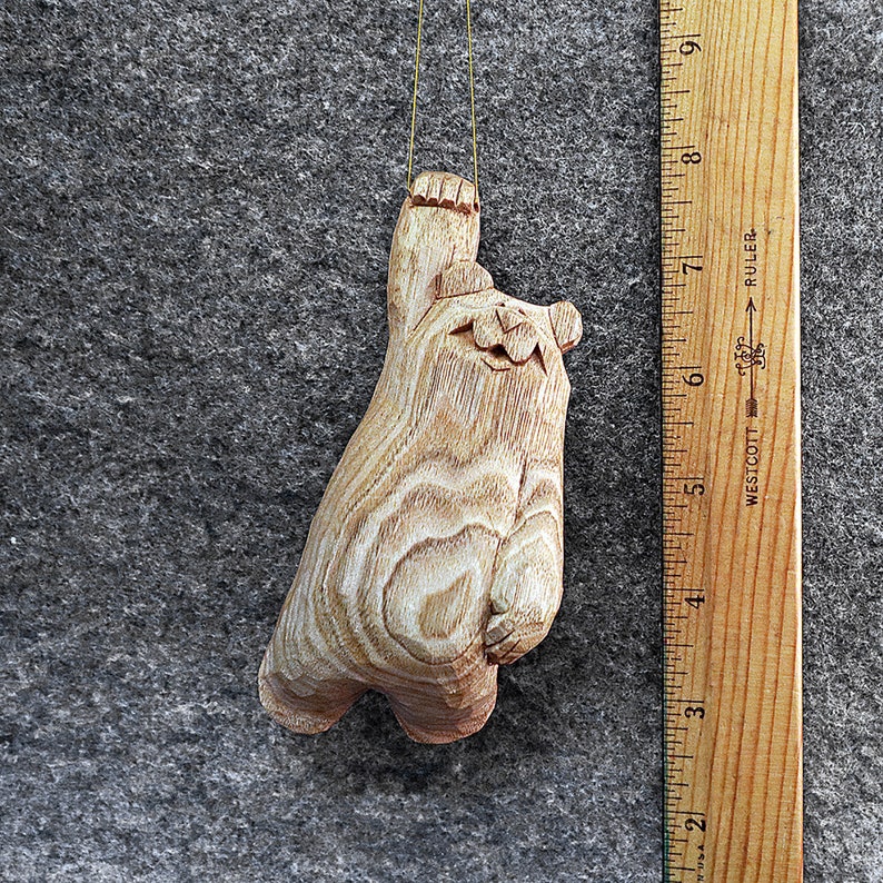 Hang in there bear ornament This artist created 5 inch original bear ornament has been hand carved from the wood of the Butternut tree.