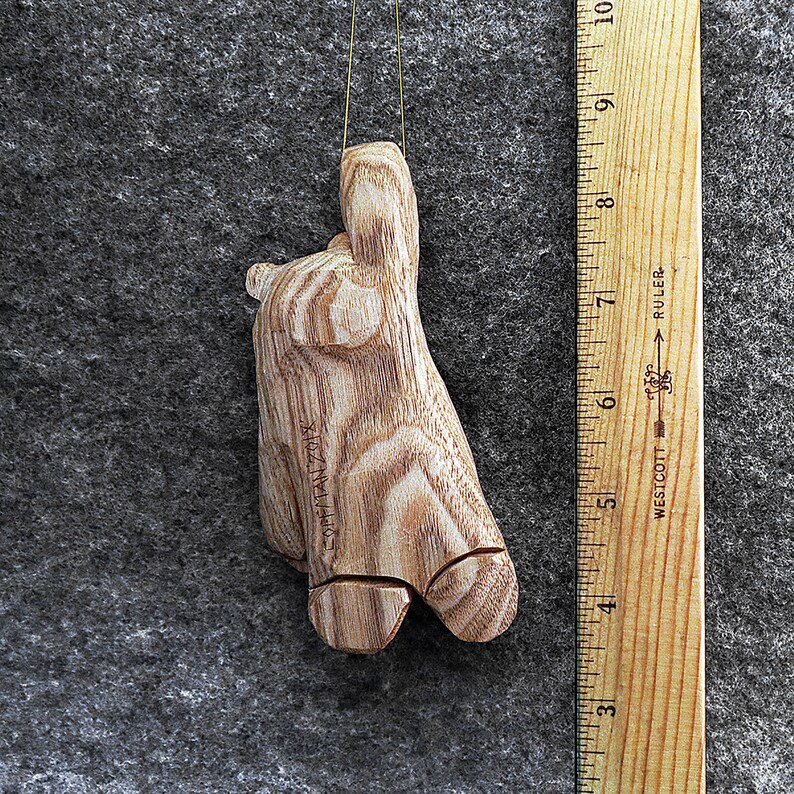 Hang in there bear ornament This artist created 5 inch original bear ornament has been hand carved from the wood of the Butternut tree.