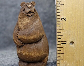 This artist carved wood bear is collectible, made in America, a miniature gift of original design; carved by hand, it makes a happy gift.