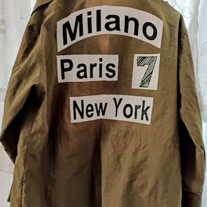 Vintage militair veldjack met patches