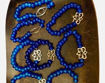 Lotus or eye charm bracelet