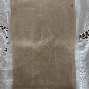 May include: A package of brown paper lunch bags, 5 5/8 x 3 x 10 inches, sealed in clear plastic. The packaging includes text that reads "Brown bag it in style!" and "Carrousel Products."