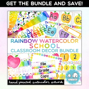 May include: A classroom decor bundle featuring watercolor illustrations of rainbows, crayons, apples, and numbers. The text "RAINBOW WATERCOLOR SCHOOL CLASSROOM DECOR BUNDLE" is displayed in a colorful banner. The text "File Grade Copy" is displayed on a sign with a rainbow crayon border. The text "1-10" is displayed on a sign with a rainbow apple border. The text "Jax & Jake" is displayed on a sign with a blue and white dog illustration.