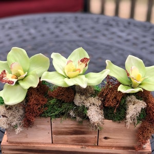 Faux Orchids Centerpiece with different types of natural moss. Mossy centerpiece, Table Decor Home decor, Floral arrangement, Faux Orchids