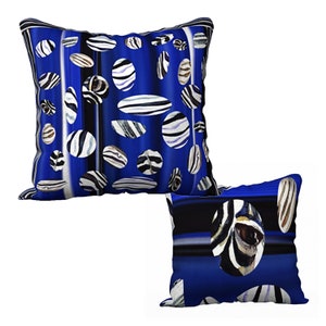 May include: Two blue throw pillows with a black and white striped pattern. The pillows are decorated with white and black circles.
