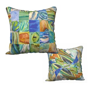 May include: Two square throw pillows with a patchwork design featuring abstract watercolour patterns in shades of blue, green, orange, and yellow.