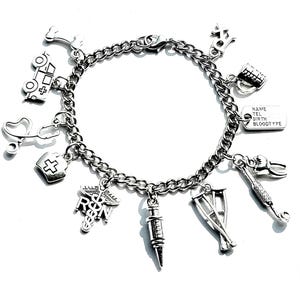 May include: Silver charm bracelet featuring medical-themed charms. Charms include a stethoscope, caduceus, syringe, ambulance, and other medical symbols. The bracelet has a chain link design and a lobster clasp closure.
