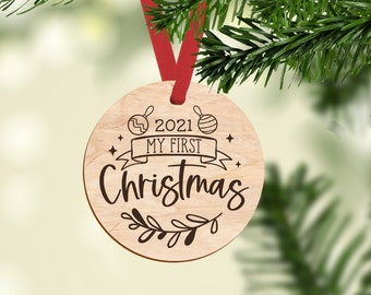 Baby's first christmas engraved wooden ornament keepsake for christmas tree or gift for new parents.