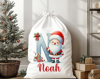 Saco de Papá Noel personalizado: bolsa de regalo navideña con inicial y nombre.