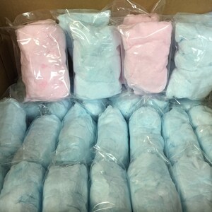 May include: A box filled with individually packaged cotton candy. There are 20 packages of blue cotton candy and 3 packages of pink cotton candy.