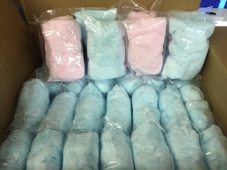May include: A box filled with individually packaged cotton candy. There are 20 packages of blue cotton candy and 3 packages of pink cotton candy.