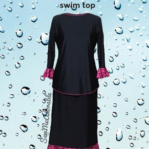 May include: A black Kenadee swim skirt and swim top set featuring long sleeves with pink and black chevron patterned ruffled cuffs and a matching ruffled hem on the skirt. The top has a pink neckline trim and the text Kenadee swim skirt & swim top.