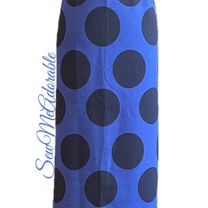 May include: A long blue skirt with a black polka dot pattern. The skirt has a wide elastic waistband.
