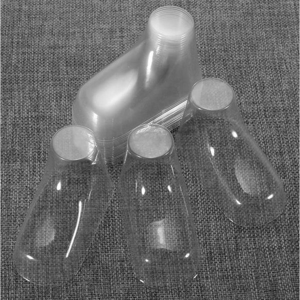 Display forms for baby booties and socks.  Clear plastic. Three sizes.