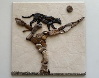 Black Panther Climbing a Tree. Pebble Mosaics. Pebble Art.