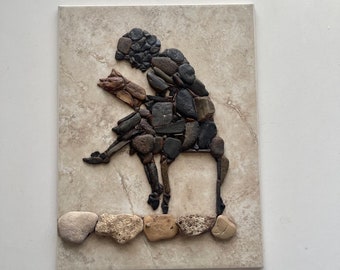 A woman with a book. Pebble Mosaics. Pebble Art.