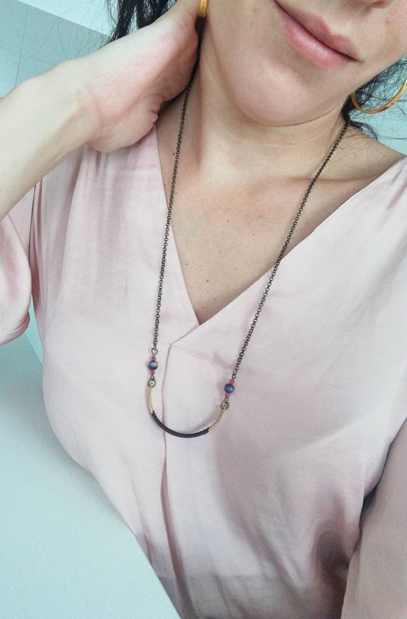Long boho style necklace with dark bronze chain and gold half moon pendant decorated with grape silk thread round beads and glass beads