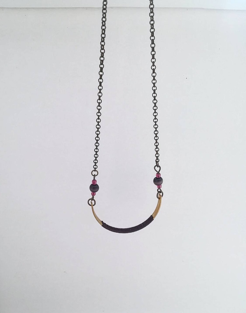 Long boho style necklace with dark bronze chain and gold half moon pendant decorated with grape silk thread round beads and glass beads