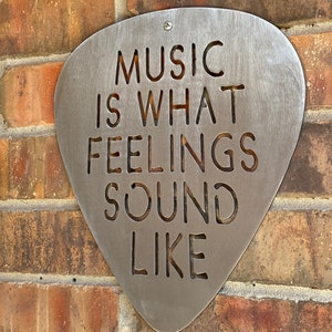 Music is what feelings sound like Steel Guitar Pick Wall Art