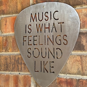 Music is what feelings sound like Steel Guitar Pick Wall Art