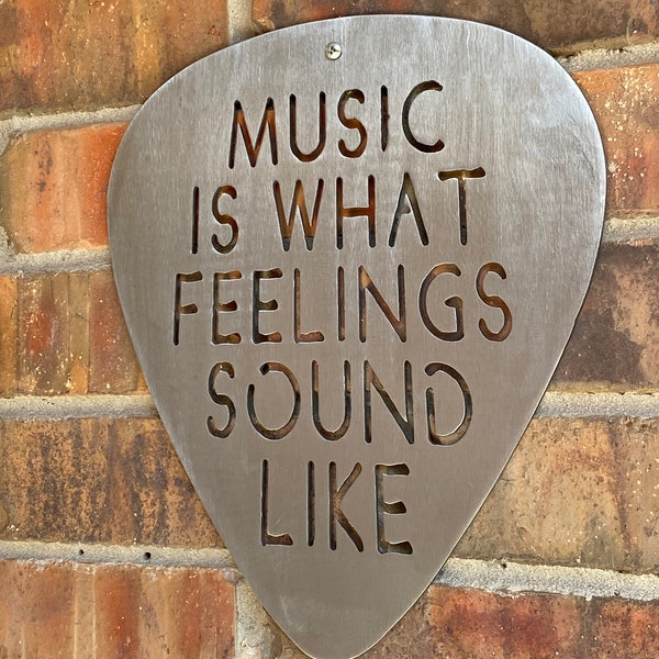 Music is what feelings sound like Steel Guitar Pick Wall Art