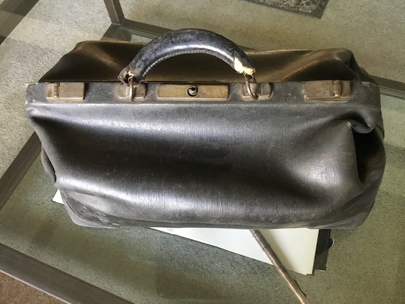 Sold at Auction: Antique leather doctor's bag with compartments