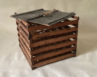 Vintage wooden egg carrier crate with egg inserts